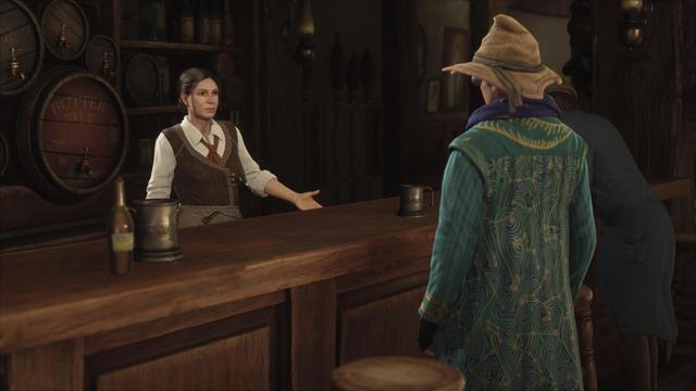 Ein Screenshot aus Hogwarts Legacy in der Schenke 'Die Drei Besen' in Hogsmeade, der die detaillierte Inneneinrichtung in 4K zeigt.