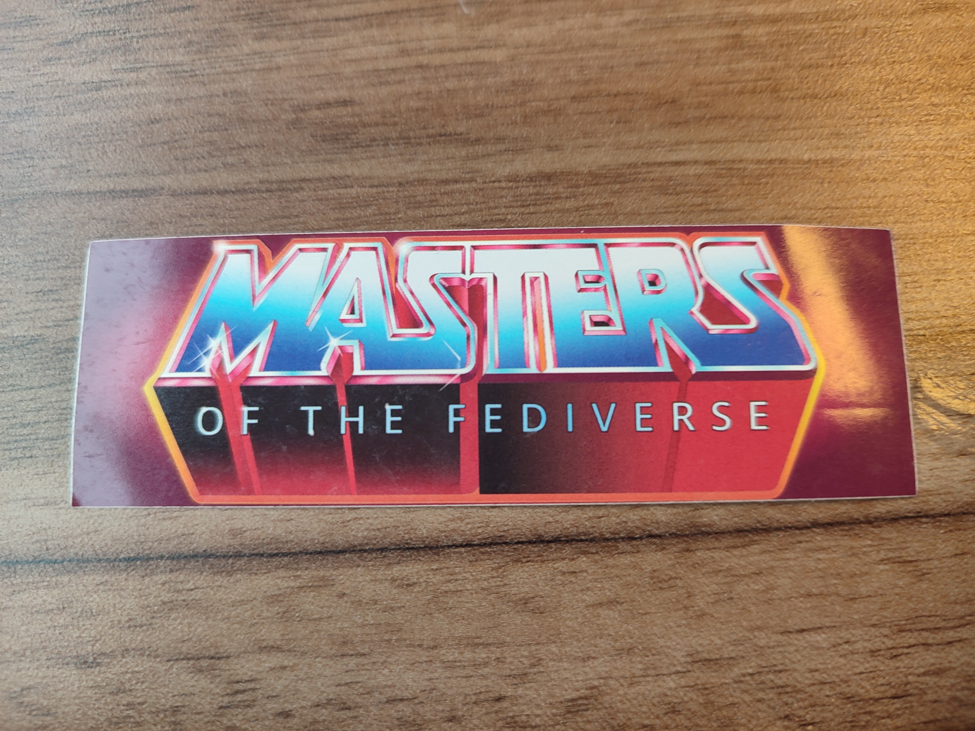 Sticker mit der Aufschrift "Masters of the Fediverse" im "Masters of the Universe" Style.