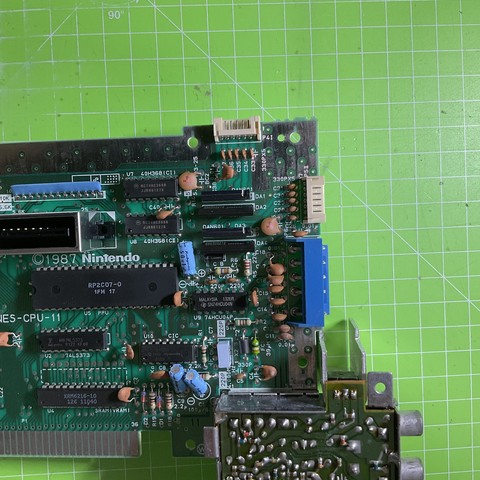 An NES motherboard extracted on my workbench. 