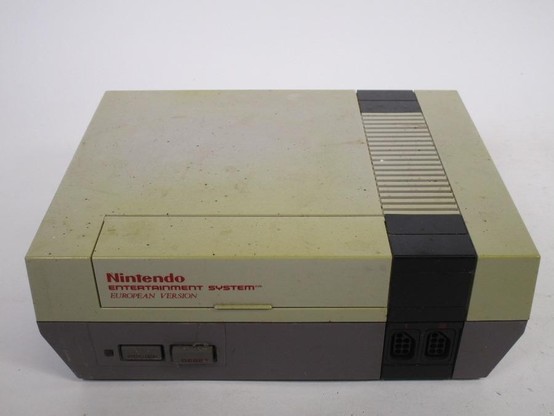 A very dirty and yellowed NES.