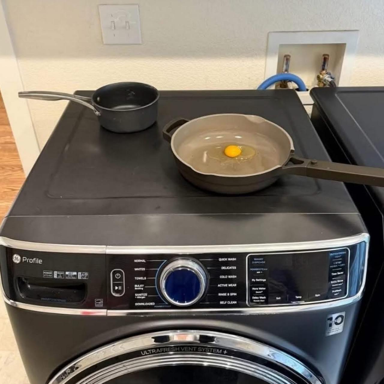 meme of a front-loader washer that looks like a stove/range on top where someone has tried to fry an egg in a skillet. meme of a front-loader washer that looks like a stove/range on top where someone has tried to fry an egg in a skillet.