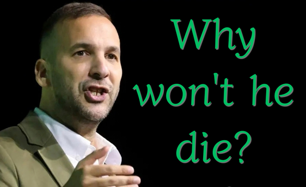 ZackPolandki is a man with short dark hair and light facial stubble. He is shown from the chest up against a solid black background.  Zack is wearing a tan blazer over a white collared shirt and is captured with their mouth open. On the right side of the image, large green text reads, "Why won't he die?" die?".
