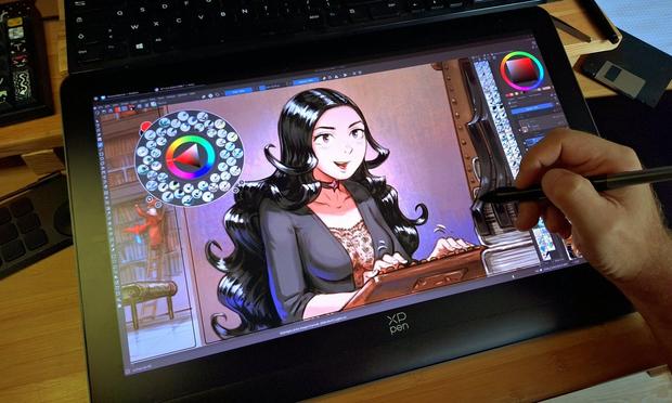 A photo of my hand over my display drawing tablet, a XPpen Artist Pro 19 and while finishing a comic episode using Krita on Linux.