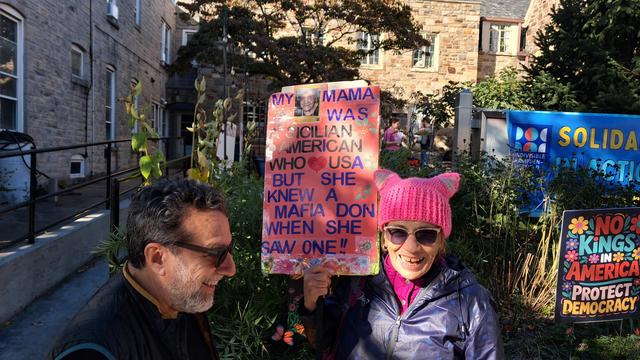 Woman with a sign:

My mama was a Sicilian American who loved the USA but she knew a mafia don when she saw one!