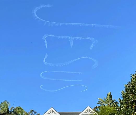 'Jesus' written in the sky on a clear sunny afternoon