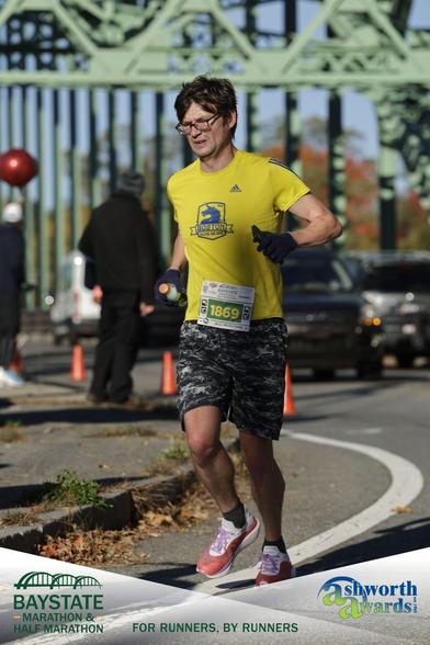 Me running the 2026 Baystate Marathon, somewhere around mile 8 or 18. (But after looking at the expression on my face I am thinking it is mile 18.)