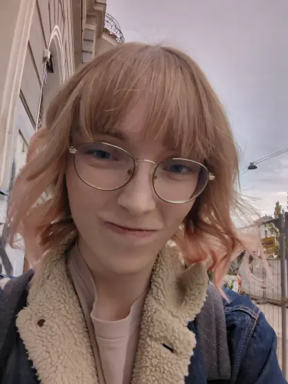 Another selfie, this time outside with me wearing a denim jacket with sherpa. I'm squinting my eyes, giving a slightly mean look.