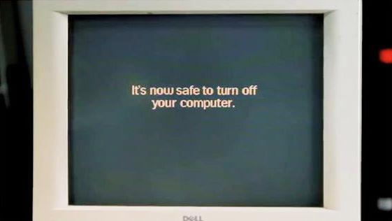 A CRT computer monitor with the message "It is now safe to turn off your computer"