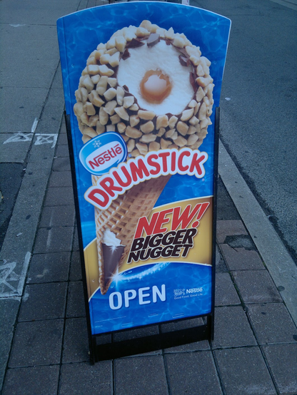 a signboard advertising nestle drumstick with a new bigger nugget