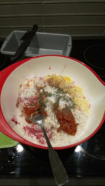 a plastic mixing bowl full of ground meat and bread crumbs and the fixin's for meatloaf like a bibimpbap ready to mix up and cook in a loaf pan