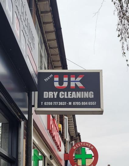 Dry cleaners. Sign outside reads UK (amusingly the letters U and K are in Union Jack) Dry Cleaners.