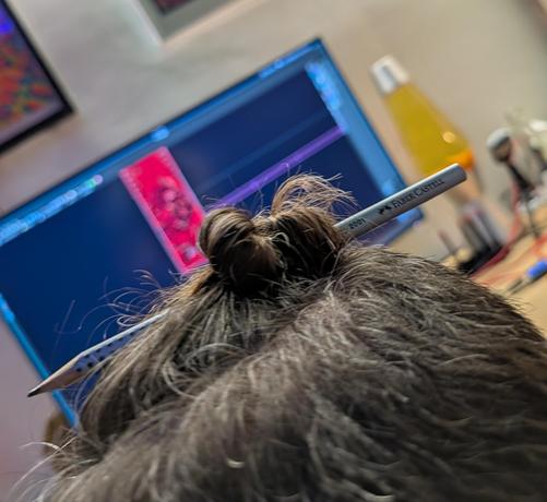 Pencil in hair.
