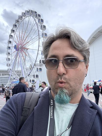 Daniel in front of an Amazon branded Ferris wheel 