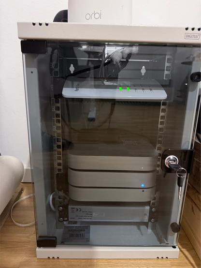 Both images. A Mini 10 inch server rack filled with 2 Mac minis and a hard drive shaped like another Mac mini 