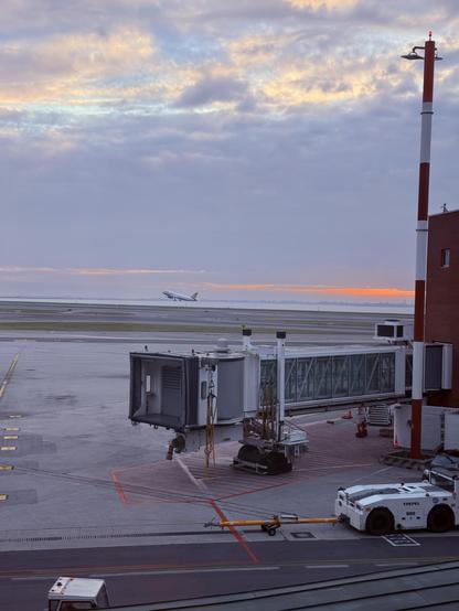 A plane departing Venice airport in the rising sun 