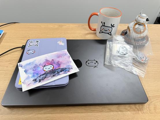 Various stickers with Sondrine, some attached to electronic devices 
