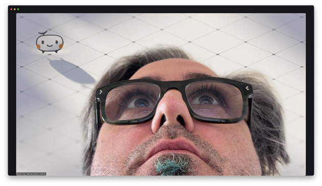 A video meeting window with Daniel's face from extremely close and below, showing lots of nostrils 