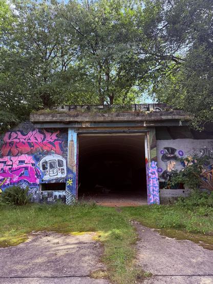 A large bunker with lots of graffiti 