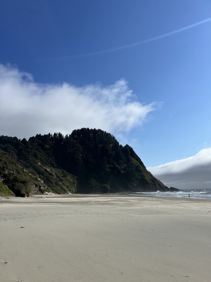 Photo of a mountain coming out of the sea. 