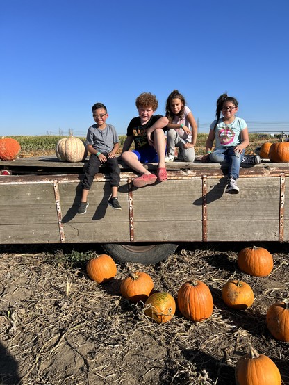 Photo of my kids and their friends on a truck at pumpkin patch. 