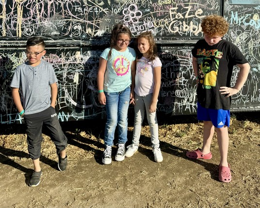 My kids in front of doodle bus