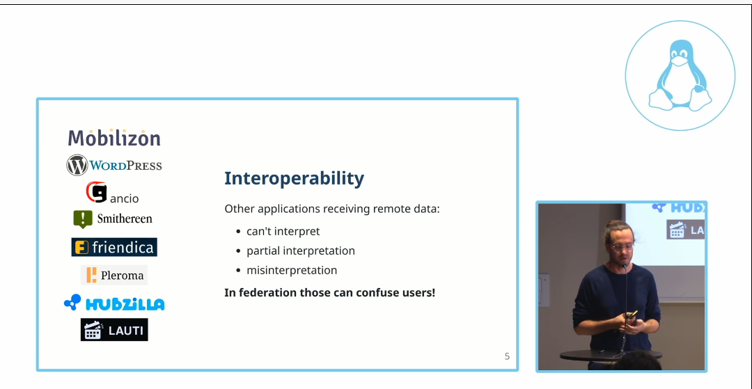A video still of André Menrath presenting the issues with federated events at SFCON