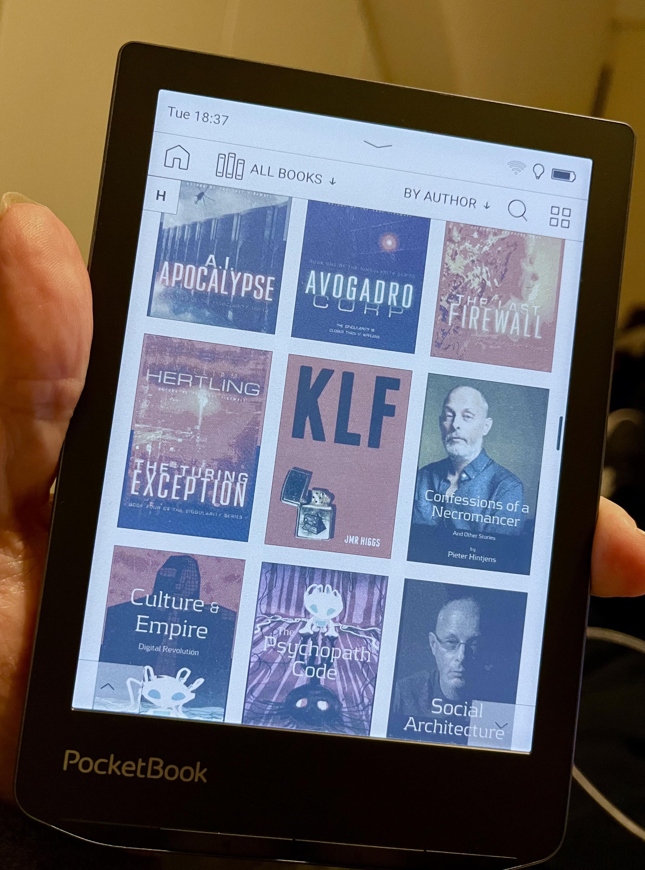 A PocketBook Verse Pro Color eBook reader, showing a bunch of book covers on its 6 inch display.