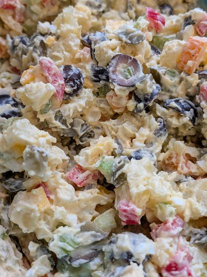 A whole bunch of freshly made potato salad.