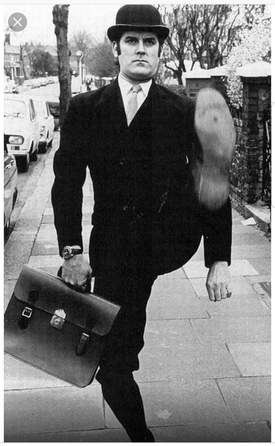 John Cleese 
The first Silly Walk champion and display of signature strut.