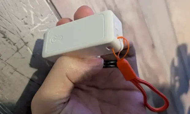 Small white box not much larger than two AAA batteries.