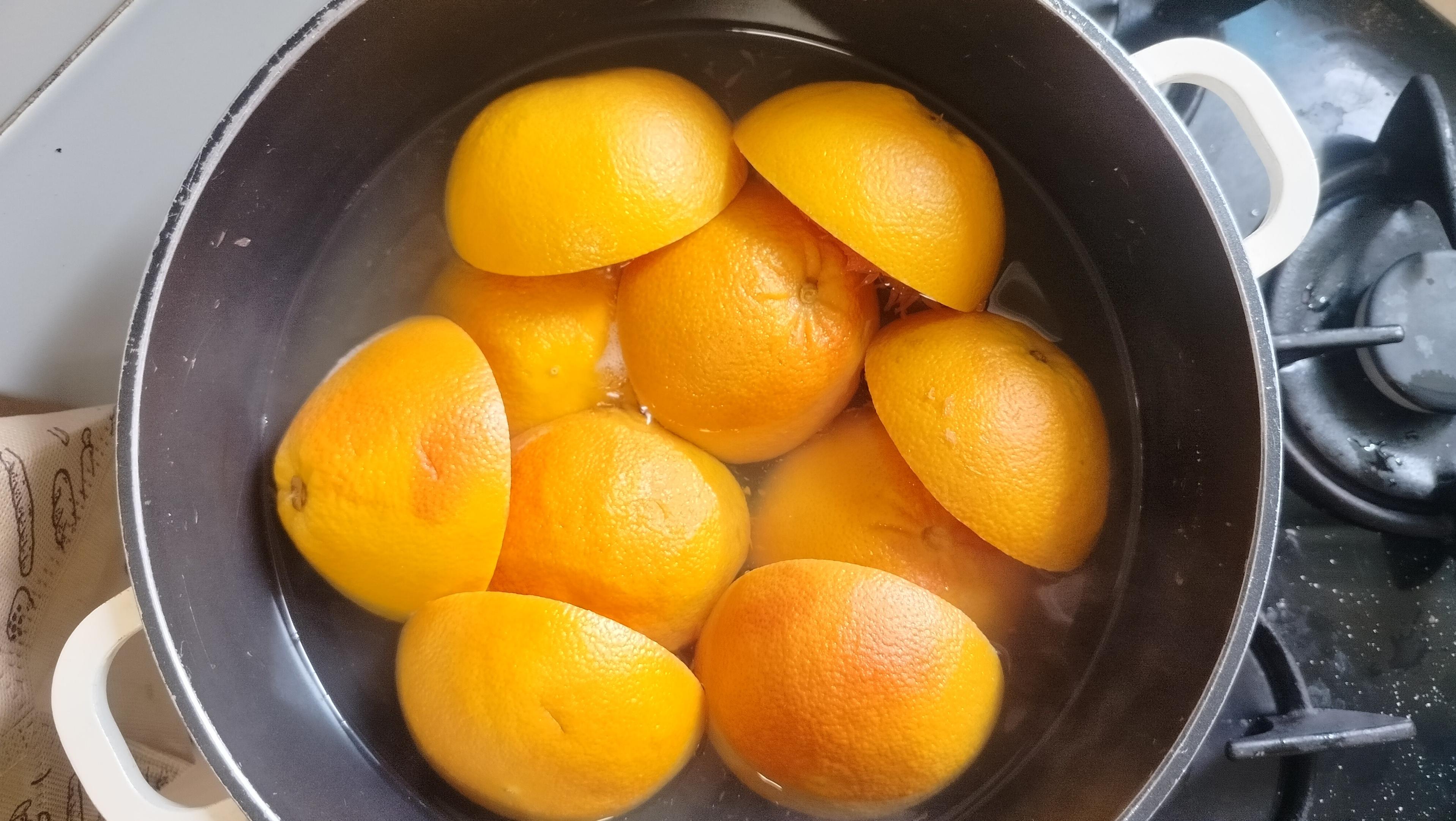 halves of red grapefruits in a pan, taken from above