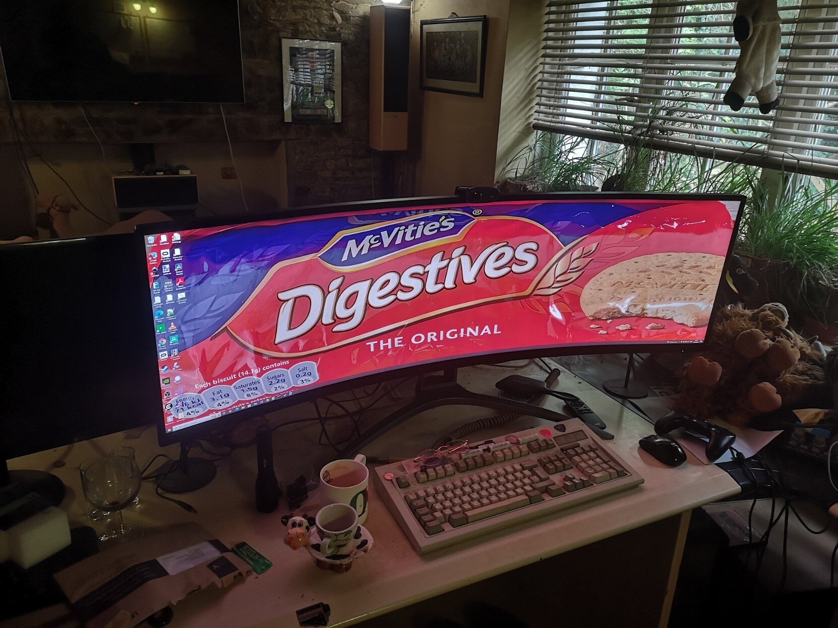 My desk, I have a super wide monitor that has Digestive biscuit packet wallpaper. I might have to change this now that McVities are engaging in price gouging AND shrinkflation at the same time.