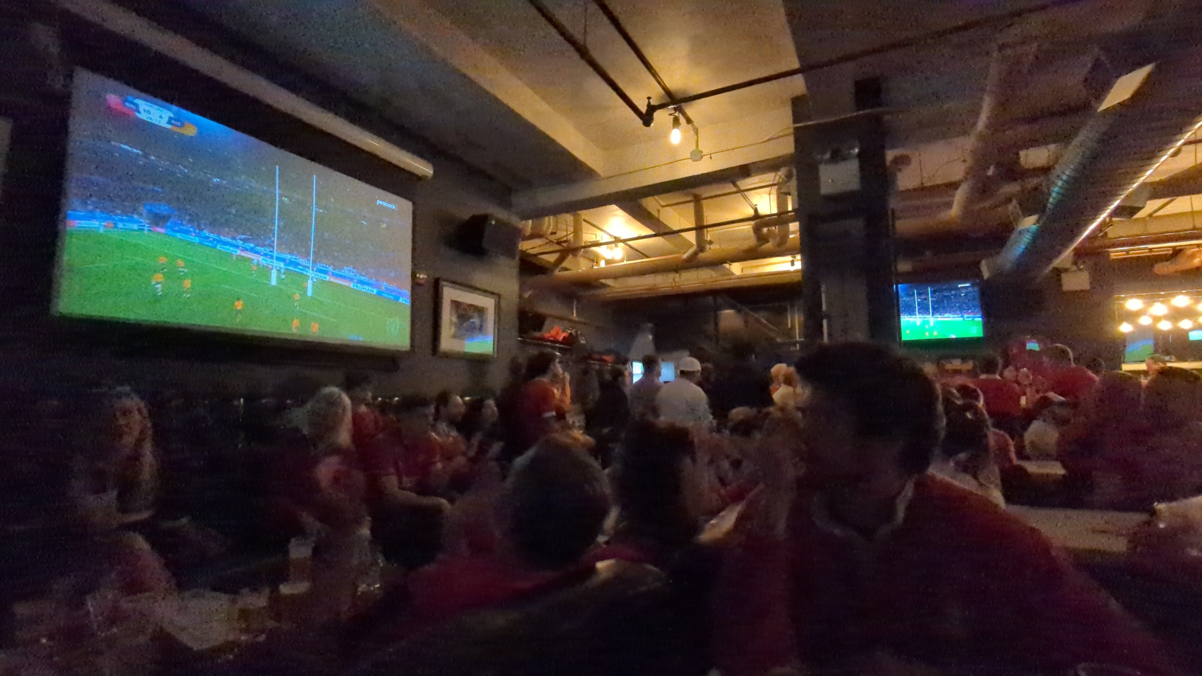 A pub room full of Welsh rugby supporters