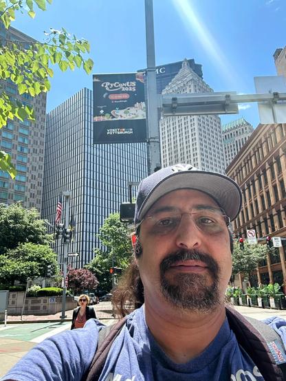 Selfie of me in front of the PyCon US banner. 