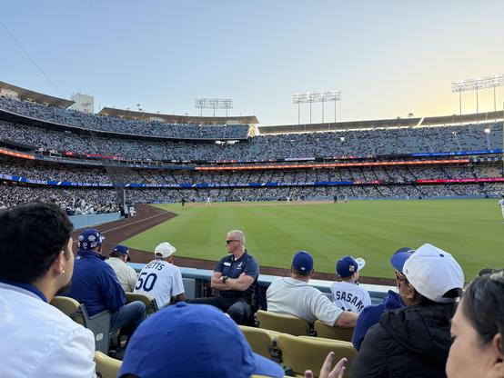 Shohei Ohtani throws out the first pitch of the game to Jung Hoo Lee of the San Francisco Giants on a beautiful night for baseball at Dodgers Stadium. We're sitting a few rows back in right field on the field level. While it's not a sellout crowd, the stadium is pretty full. 