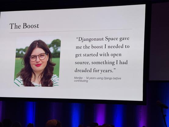 A photo of a slide from the closing keynote showing Marijke with the text:

The Boost
"Djangonaut Space gave me the boost I needed to get started with open source, something I had dreaded for years."
Marijke • 14 years using Django before contributing