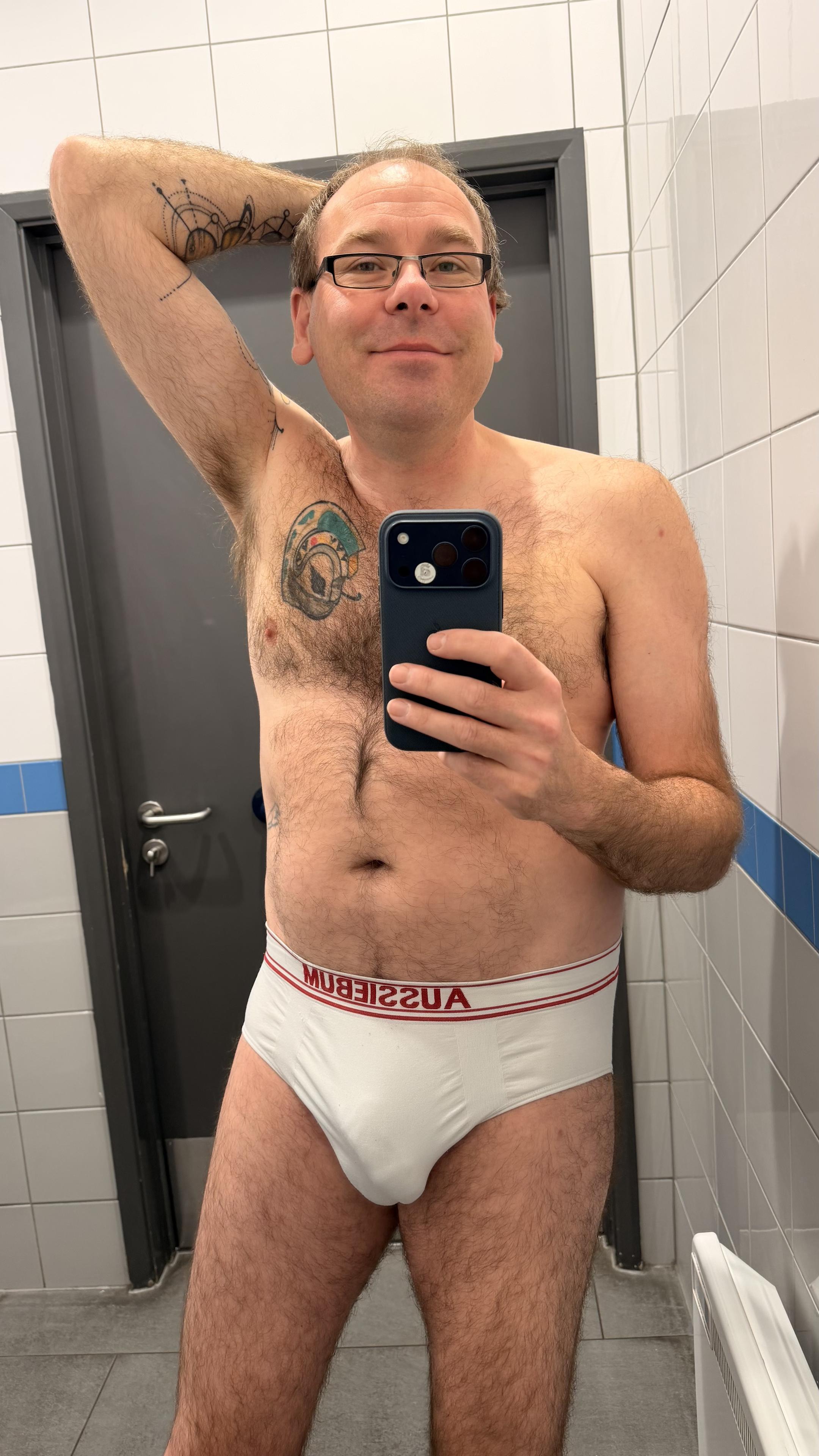 Hairy gay guy wearing white aussieBum briefs