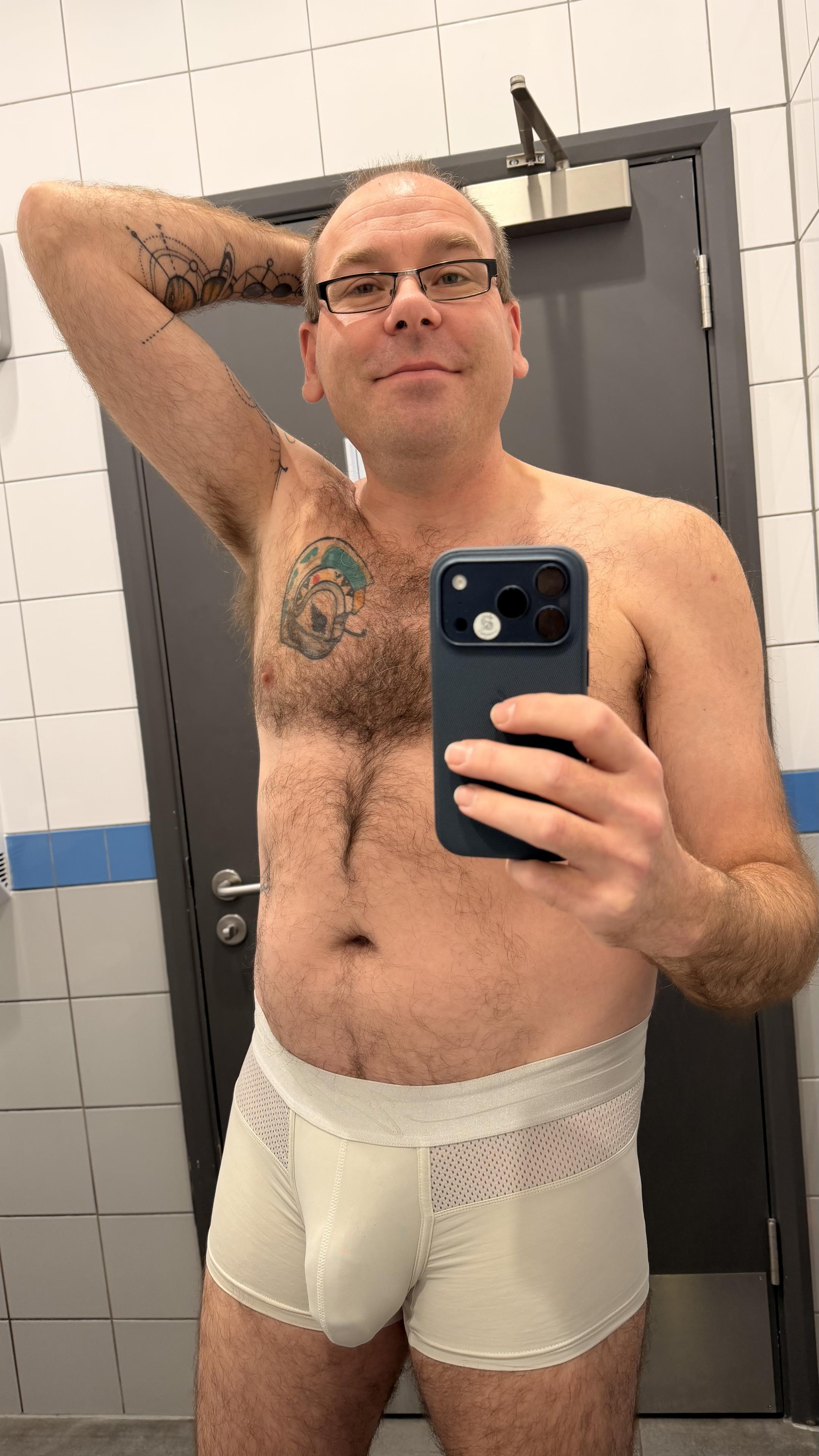 Hairy gay guy wearing off white teamm8 trunks