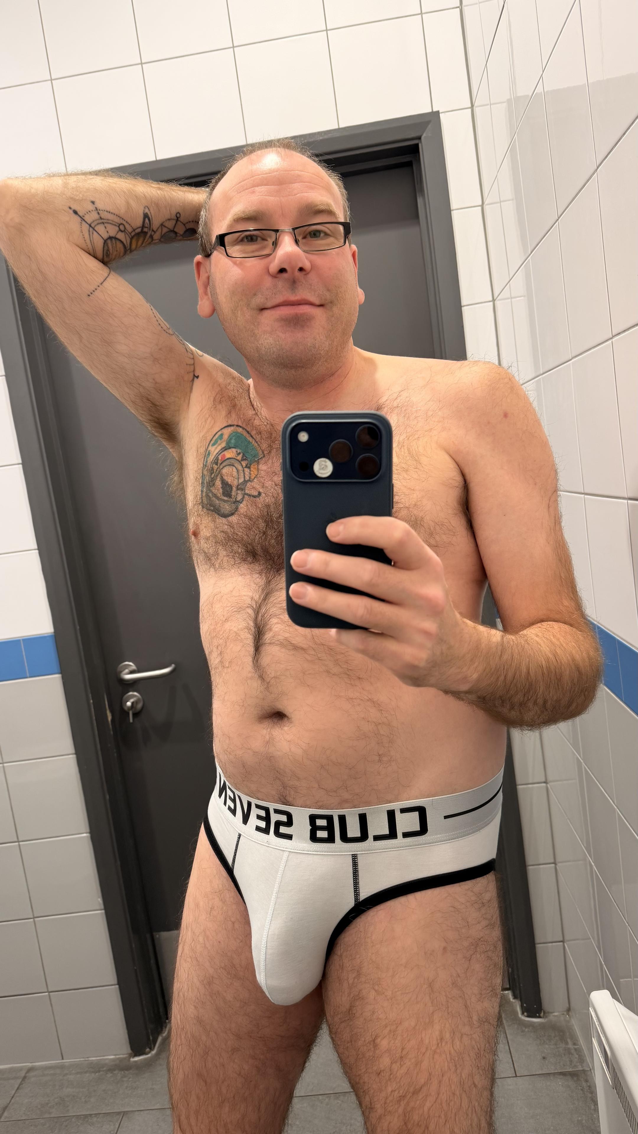 Hairy gay guy wearing white Club Seven briefs with silver waistband