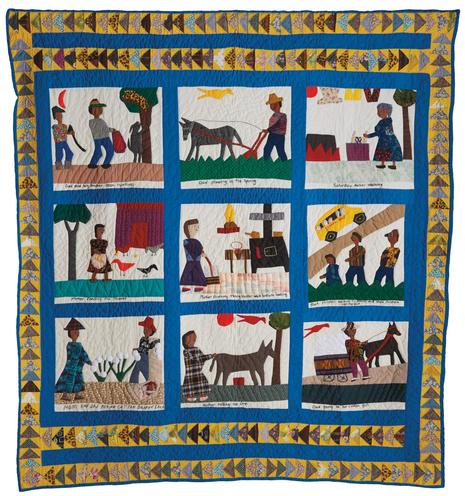 a pictorial quilt with nine frames showing people and animals in everyday activities, surrounded by a blue border and geometric patterns