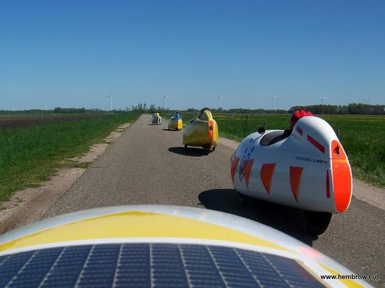 Riding through the countryside. The wind turbines in the background are not turning. They're switched off for the same reason as my solar panels are: Today's electricity price is very negative.