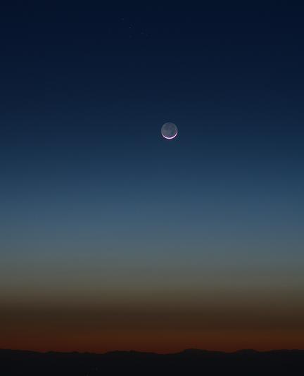 In moderate twilight the Pleiades were just becoming visible to the camera, and earthshine on the moon's disk was about as bright as the twilight sky.