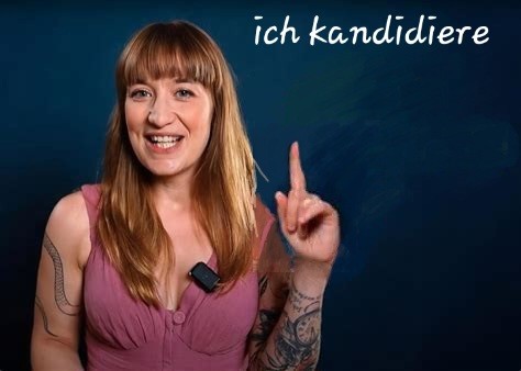 Reichineck, erhobener ziegefinger, spruch: ich kandidiere