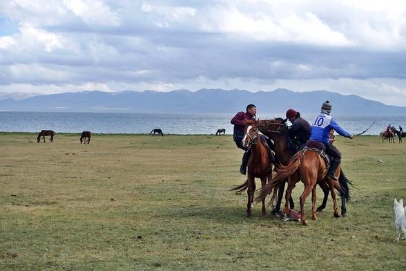 The powerful game of Kok-Burro at the shores of Lake Son-Kul. What an incredible skill and horsemanship of the Kyrgyz people. One can only be in awe of the raw force in animal, human and the surrounding nature. 

#Kyrgysztan #horses #landscape #sport #silkroad #overland #travel #travelphotography #photography #landscapephotographgy #solotravel #solofemaletravel