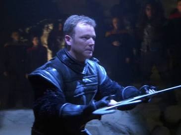 Tom Paris with bat’leth and Klingon gear
