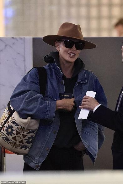Charlize Theron was spotted looking almost unrecognisable as she jetted out of Sydney on Friday