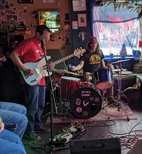 bass/drums duo in the corner of a bar