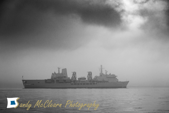 Naval replenishment tanker in thick fog.