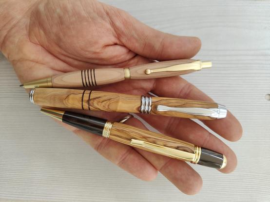 Photo of three handmade wood pens