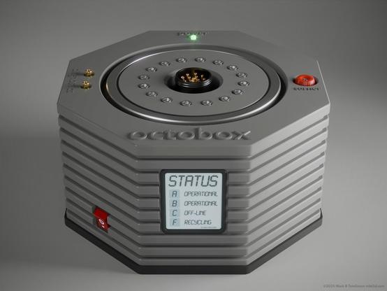grey octagonal box with circular insert top a LCD screen on the front reading status: operational and off-line